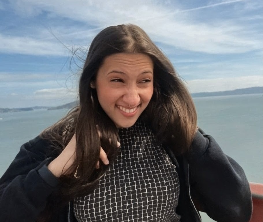 Elaina outdoors by the water